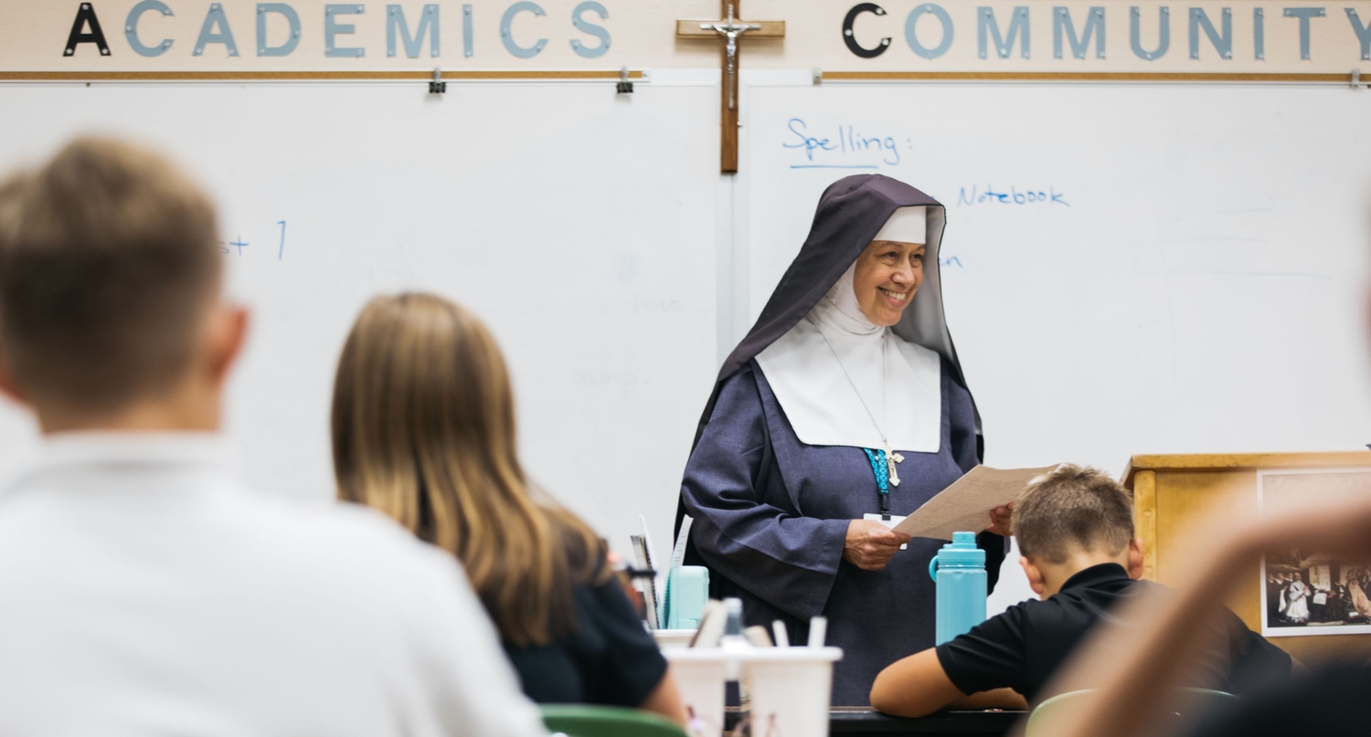 A teaching sister leading a Saint Charles classroom